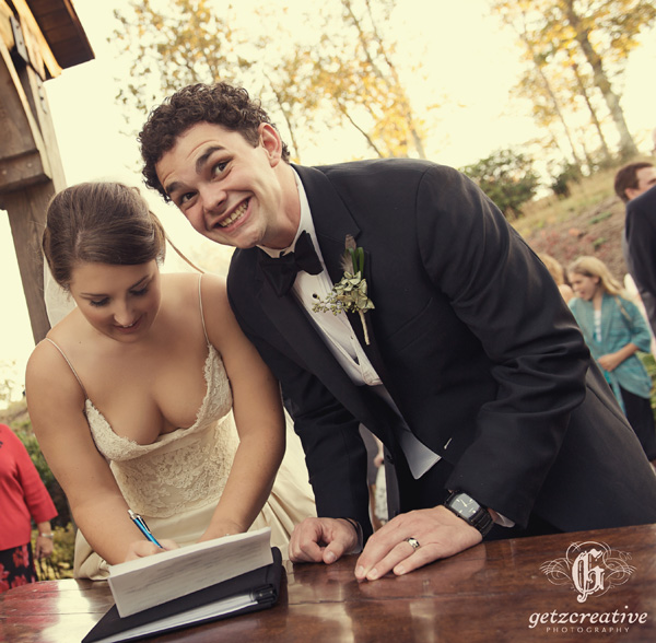 bride and groom signing marriage certificate cliffs at glassy - wedding photography