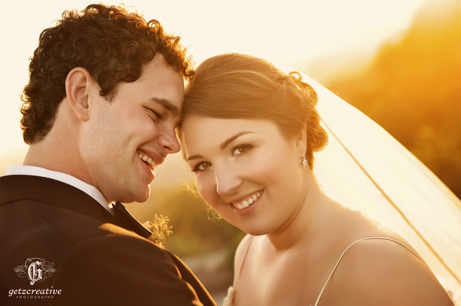 bride & groom smiling at sunset cliffs at glassy - wedding photography - Greenville South Carolina 
