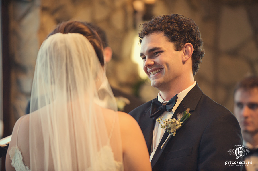 groom all smiles at bride cliffs at glassy - wedding photography