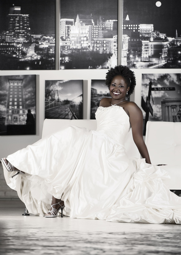Bride sitting with black and white images of Downtown Greenville in background | Bridal Photography Session | Getz Creative Photography | Greenville, South Carolina
